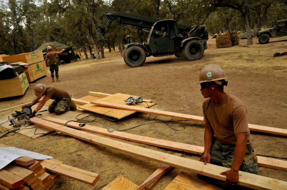 US Navy 110923-N-SM578-009 Seabees assigned to Naval Mobile Construction Battalion (NMCB) 40, Bravo Company, cut lumber for building projects durin