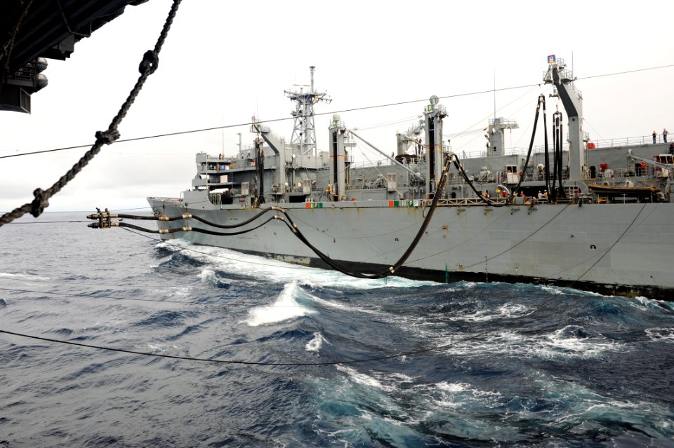 US Navy 110926-N-AU622-050 The Military Sealift Command fast combat support ship USNS Arctic (T-AOE 8) sends a fuel line to the aircraft carrier US