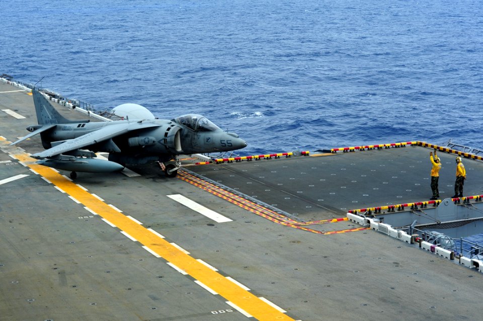 US Navy 110925-N-WA347-265 An AV-8B Harrier taxis into position on the flight deck of USS Essex (LHD 2)