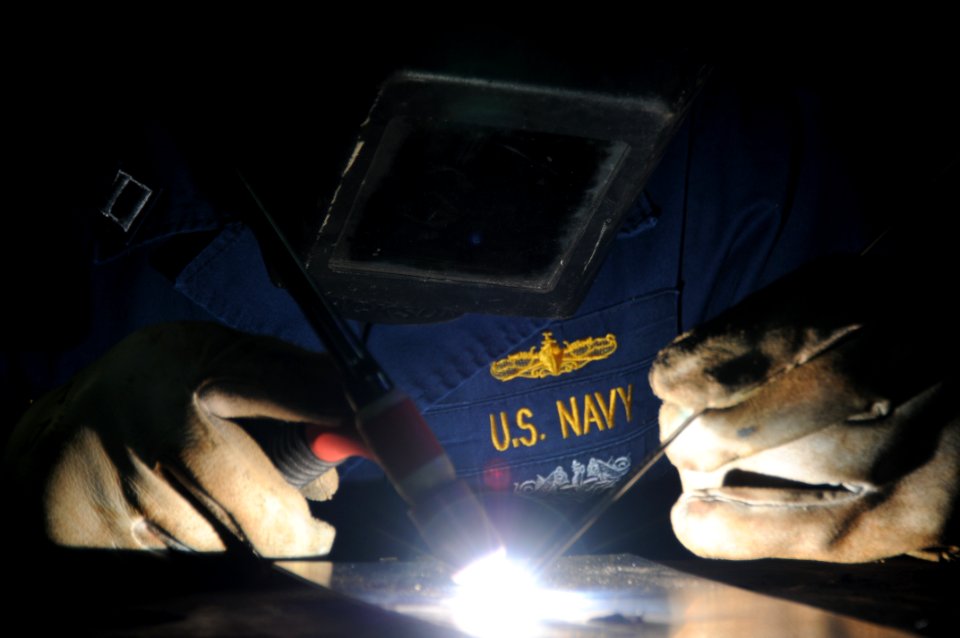 US Navy 110926-N-TU894-095 Lt. Charles A. Longeway welds in the machine shop aboard USS George H.W. Bush (CVN 77)