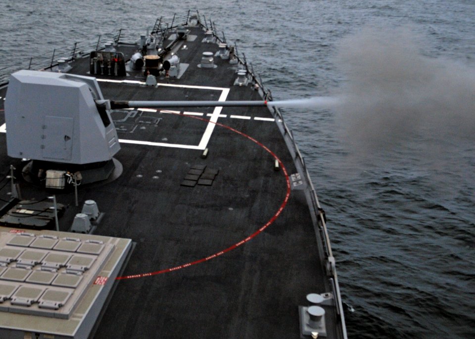 US Navy 110925-N-ZF681-209 The MK-45 5 inch-54-caliber lightweight gun of the guided-missile destroyer USS Halsey (DDG 97) is fired during a live-f