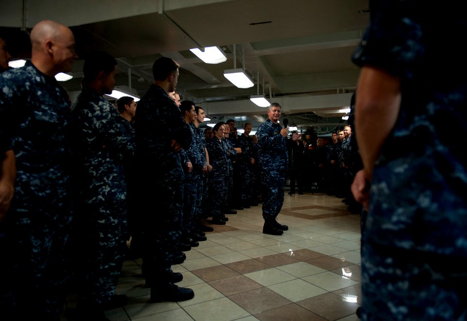 US Navy 110926-N-DR144-111 Vice Adm. Gerald R. Beaman speaks to Sailors during an all-hands call on the mess decks aboard USS Carl Vinson (CVN 70)