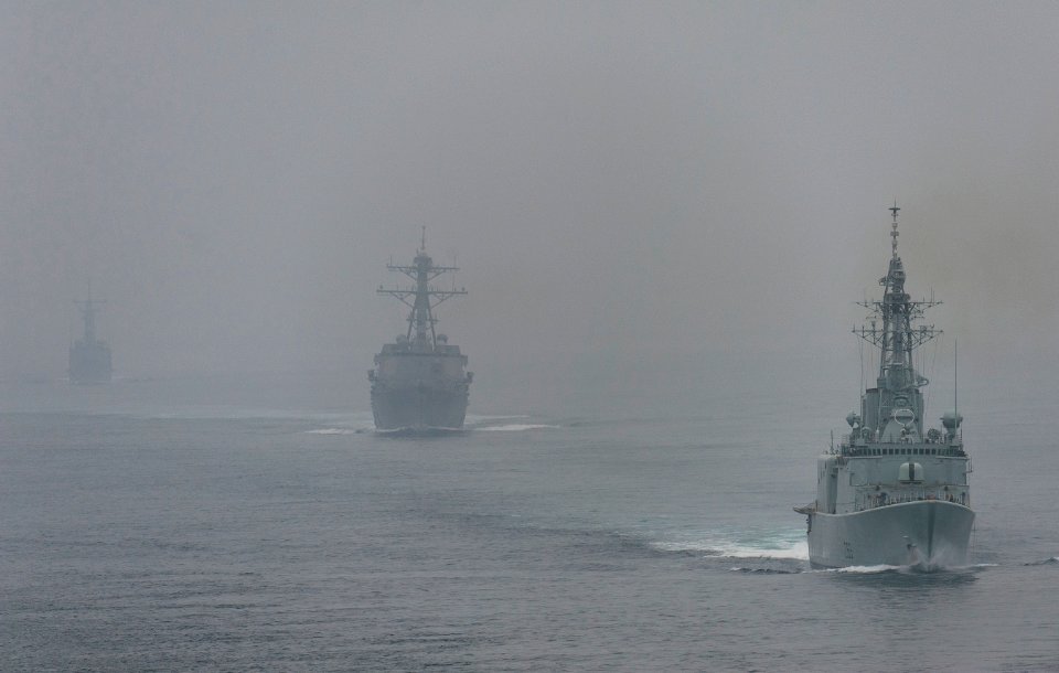 US Navy 110928-N-DR144-390 The Royal Canadian Navy destroyer HMCS Algonquin (DDGH 283) leads the Arleigh Burke-class guided-missile destroyer USS S