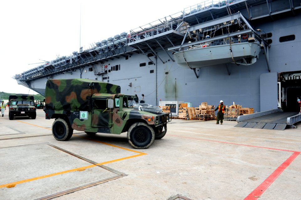 US Navy 110926-N-WA347-026 High mobility multipurpose vehicles assigned to the 31st MEU board USS Essex (LHD 2) at White Beach Naval Facility Okina