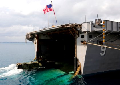 US Navy 110924-N-WJ771-076 Marines assigned to the 31st Marine Expeditionary Unit (31st MEU) pilot an amphibious assault vehicle into the well deck