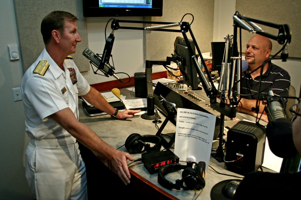 US Navy 110926-N-ZL585-138 Rear Adm. Walter E. Carter Jr., commander of Joint Enabling Capabilities Command, is interviewed by radio host Chris Kel