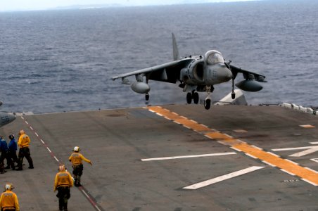 US Navy 110925-N-ER662-360 An AV-8B Harrier assigned to Marine Attack Squadron (VMA) 214 lands on the flight deck of the forward-deployed amphibiou