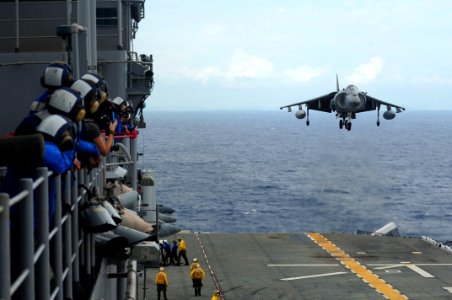 US Navy 110925-N-WA347-526 Aviation boatswain's mates watch from Vulture's Row as an AV-8B Harrier assigned to Marine Attack Squadron (VMA) 214 lan