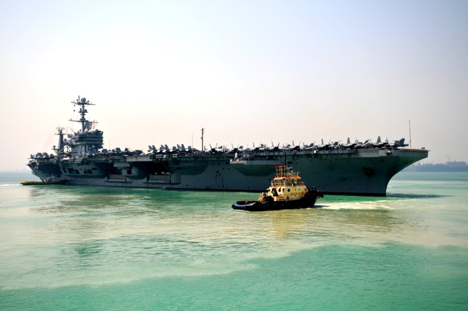 US Navy 110925-N-YM590-070 The Nimitz-class aircraft carrier USS John C. Stennis (CVN 74) departs Manama, Bahrain, after a scheduled port visit