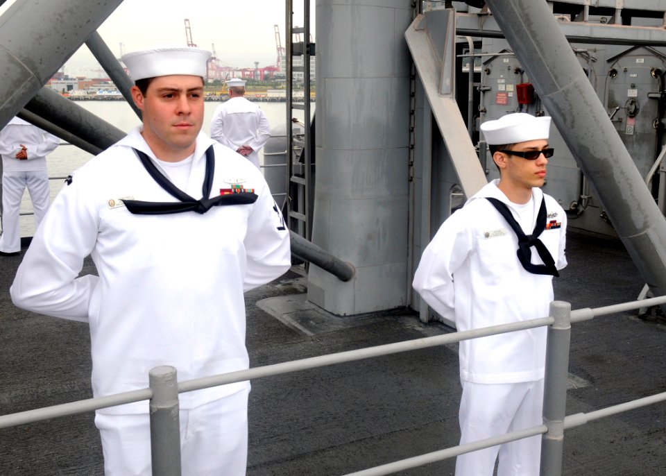 US Navy 110929-N-KB052-129 Electronics Technician 3rd Class Griffin Cantrell, left, and Electronics Technician 2nd Class Justin Dejan man the rails