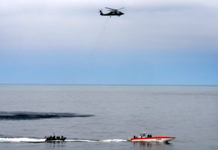 US Navy 110926-N-BC134-098 The visit, board, search and seizure (VBSS) team assigned to the guided-missile cruiser USS Bunker Hill (CG 52) transits photo