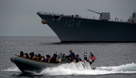 US Navy 110928-N-TU221-307 Sailors assigned to the visit, board, search and seizure team aboard USS Sterett (DDG 104) make an approach to a high vi photo