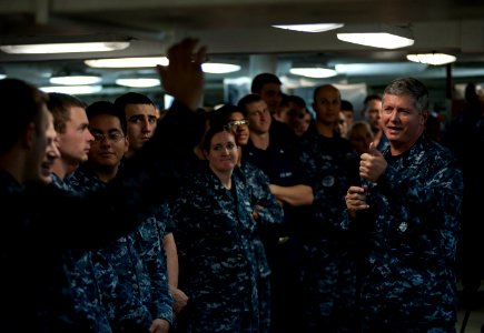 US Navy 110926-N-DR144-172 Vice Adm. Gerald R. Beaman speaks to Sailors during an all-hands call on the mess decks aboard USS Carl Vinson (CVN 70) photo
