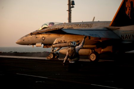 US Navy 110927-N-ZZ999-021 An F-A-18C Hornet assigned to the Golden Dragons of Strike Fighter Squadron (VFA) 192 launches from the Nimitz-class air