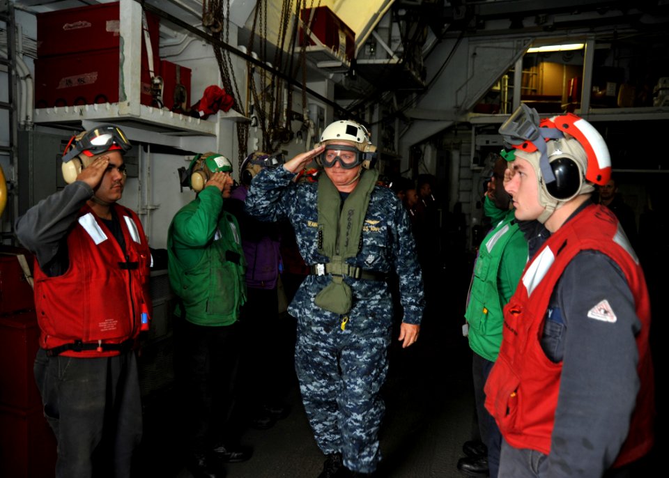 US Navy 110927-N-YB753-205 Vice Adm. Gerald R. Beaman, commander of U.S. 3rd Fleet, passes through rainbow sideboys as he departs the guided-missil