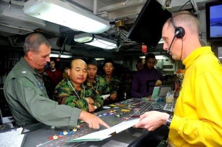 US Navy 110928-N-SF704-138 Capt. Kenneth Reynard, executive officer of the aircraft carrier USS George Washington (CVN 73), left, discusses the shi