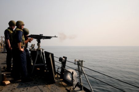 US Navy 110928-N-XQ375-167 Quartermaster Seaman Apprentice Maximilian Trenkle, left, and Chief Gunner's Mate Richard Randle, observe as Electronics