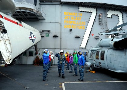 US Navy 110927-N-YB753-005 Vice Adm. Gerald R. Beaman, commander of U.S. 3rd Fleet, passes through rainbow sideboys as he departs the aircraft carr photo