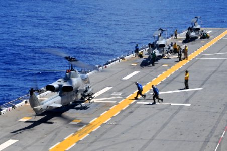US Navy 110928-N-KM175-006 AH-1Z Super Cobra helicopters assigned to Marine Medium Helicopter Squadron (HMM) 265 land aboard the forward deployed a