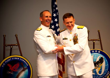 US Navy 110930-N-KK576-324 Chief of Naval Operations (CNO) Adm. Jonathan W. Greenert congratulates Vice Adm. Michael S. Rogers after Rogers' promot