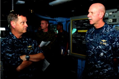 US Navy 110929-N-WA347-008 Rear Adm. J. Scott Jones and Vice Adm. Scott H. Swift speak on the bridge during a visit to the forward-deployed amphibi