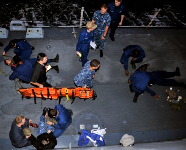 US Navy 110928-N-ZF681-341 Sailors participate in a mass casualty drill aboard the guided-missile destroyer USS Halsey (DDG 97)