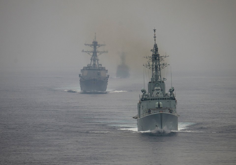 US Navy 110928-N-DR144-635 The Royal Canadian Navy destroyer HMCS Algonquin (DDGH 283) leads the Arleigh Burke-class guided-missile destroyer USS S