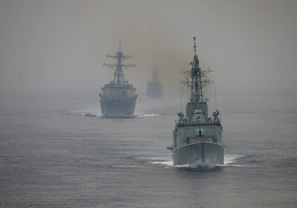 US Navy 110928-N-DR144-635 The Royal Canadian Navy destroyer HMCS Algonquin (DDGH 283) leads the Arleigh Burke-class guided-missile destroyer USS S