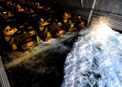 US Navy 110929-N-WJ771-070 A wave rolls into the well deck of the forward-deployed amphibious transport dock ship USS Denver (LPD 9) where amphibio