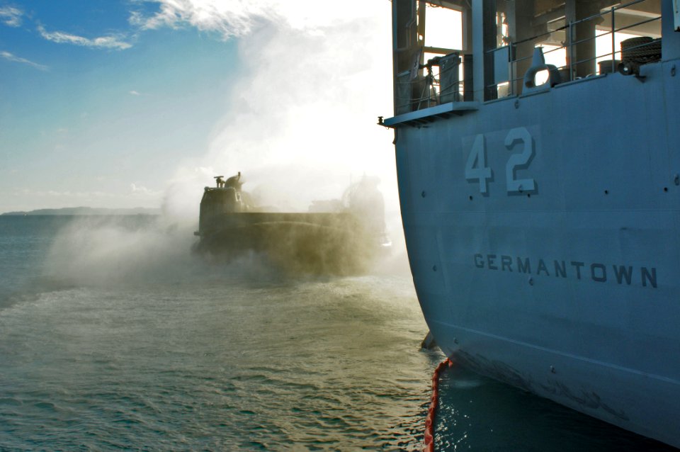US Navy 110929-N-MW330-403 A landing craft air cushion exits the well deck of the forward-deployed amphibious dock landing ship USS Germantown (LSD