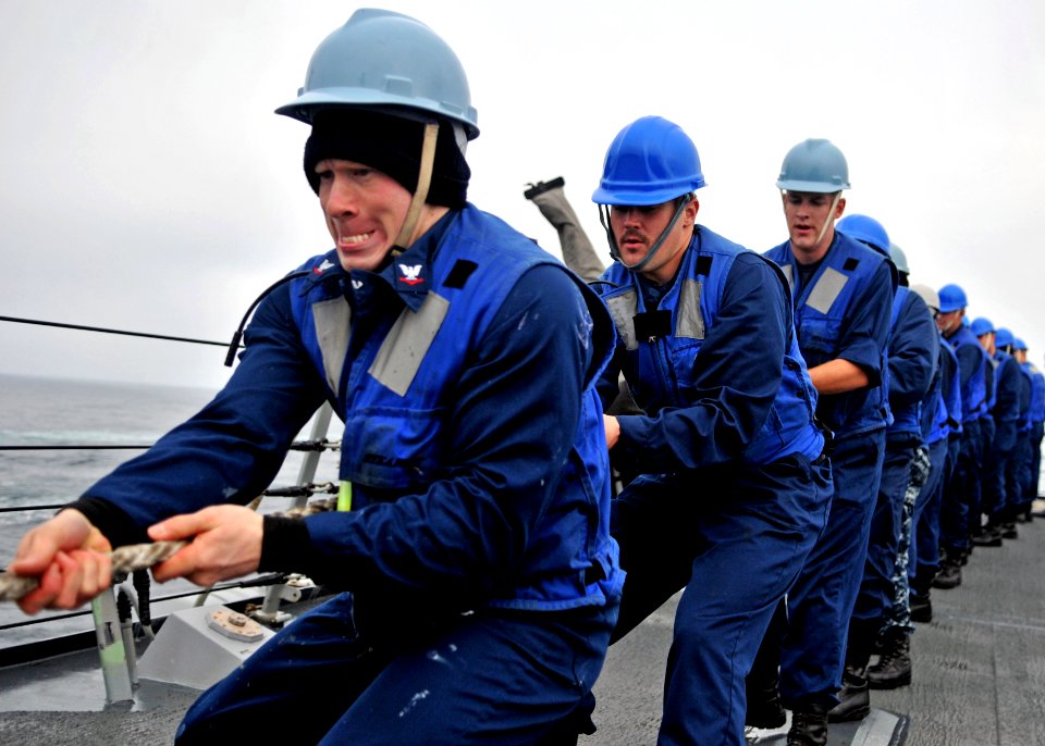 US Navy 110927-N-ZF681-132 Sailors heave a fuel line aboard the guided-missile destroyer USS Halsey (DDG 97) during a replenishment at sea with the