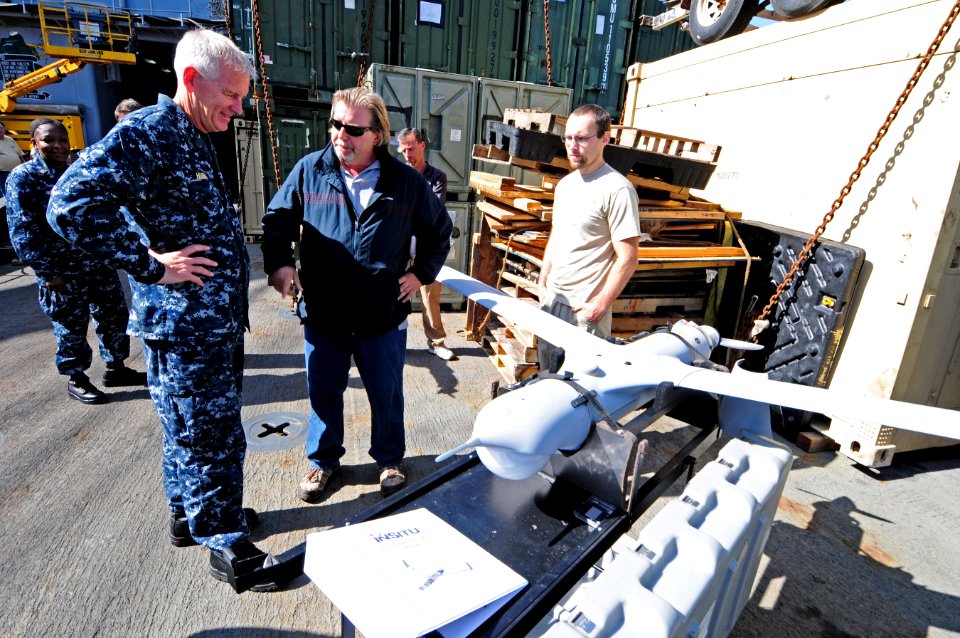 US Navy 110929-N-RC734-079 k Drago, a Scan Eagle technician, center, briefs Rear Adm. Gerard P. Hueber, left, commander of Expeditionary Strike Gro