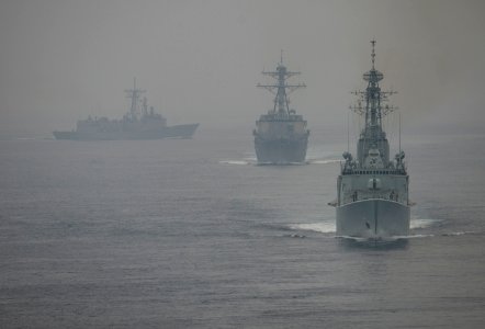 US Navy 110928-N-DR144-626 The Royal Canadian Navy destroyer HMCS Algonquin (DDGH 283) leads the Arleigh Burke-class guided-missile destroyer USS S