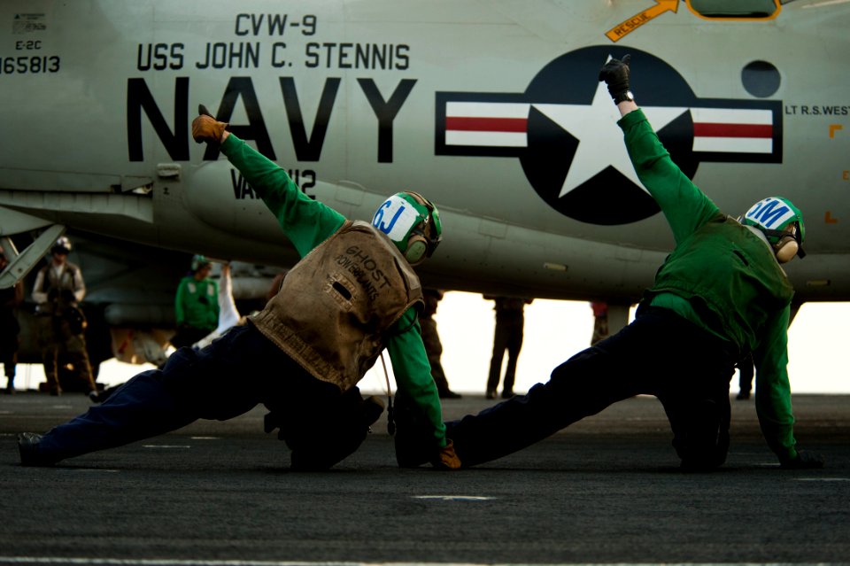 US Navy 111003-N-BT887-277 Troubleshooters assigned to the Golden Hawks of Airborne Early Warning Squadron (VAW) 112 give the approval to launch