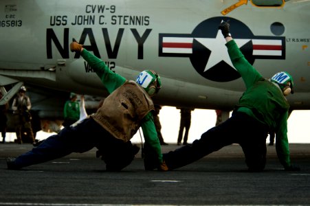 US Navy 111003-N-BT887-277 Troubleshooters assigned to the Golden Hawks of Airborne Early Warning Squadron (VAW) 112 give the approval to launch