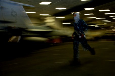 US Navy 111003-N-DR144-057 Sailors aboard the Nimitz-class aircraft carrier USS Carl Vinson (CVN 70) run to man their battle stations during an uns