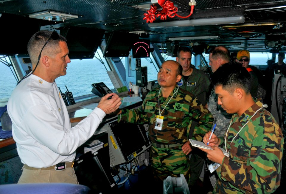 US Navy 110928-N-SF704-107 Capt. David A. Lausman, commanding officer of the aircraft carrier USS George Washington (CVN 73), left, speaks with Rep
