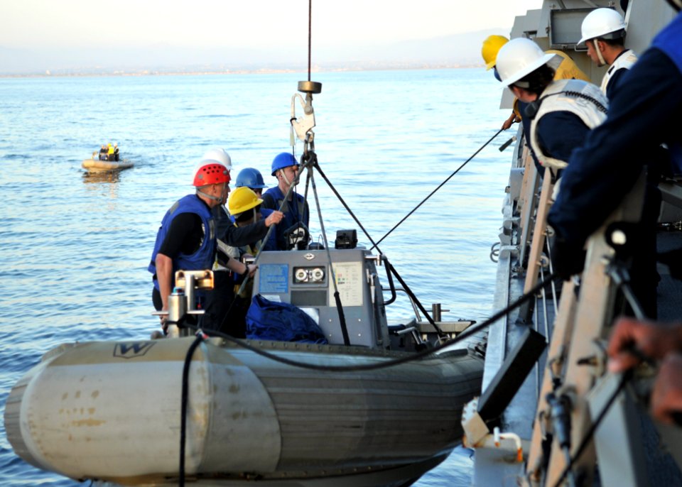 US Navy 110928-N-ZF681-143 Sailors raise a rigid-hull inflatable boat aboard the guided-missile destroyer USS Halsey (DDG 97). Halsey is underway c