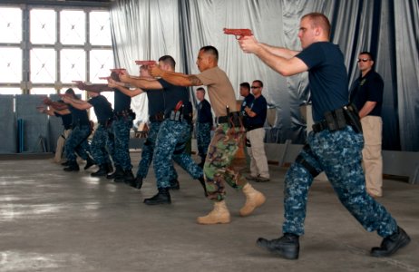 US Navy 110928-N-WX059-180 Students attending the 15-day Security Reaction Force-Basic (SRF-B) training session practice pier movements