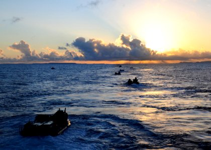 US Navy 110929-N-WJ771-117 Amphibious assault vehicles assigned to the 31st Marine Expeditionary Unit (31st MEU) head towards sunset after disembar