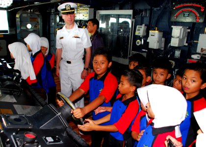 US Navy 111004-N-VP123-071 Lt. j.g. Artemas Richardson, a public affairs officer aboard the Arleigh Burke-class guided-missile destroyer USS Dewey photo