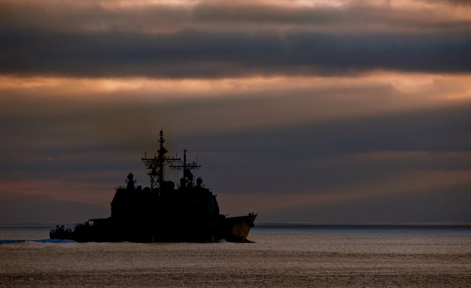 US Navy 110930-N-TU221-152 The Ticonderoga-class guided-missile cruiser USS Cape St. George (CG 71) leads the Nimitz-class aircraft carrier USS Abr