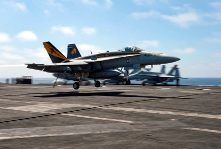 US Navy 111001-N-DR144-007 An F-A-18C Hornet assigned to Strike Fighter Squadron (VFA) 25 makes an arrested landing aboard the Nimitz-class aircraf