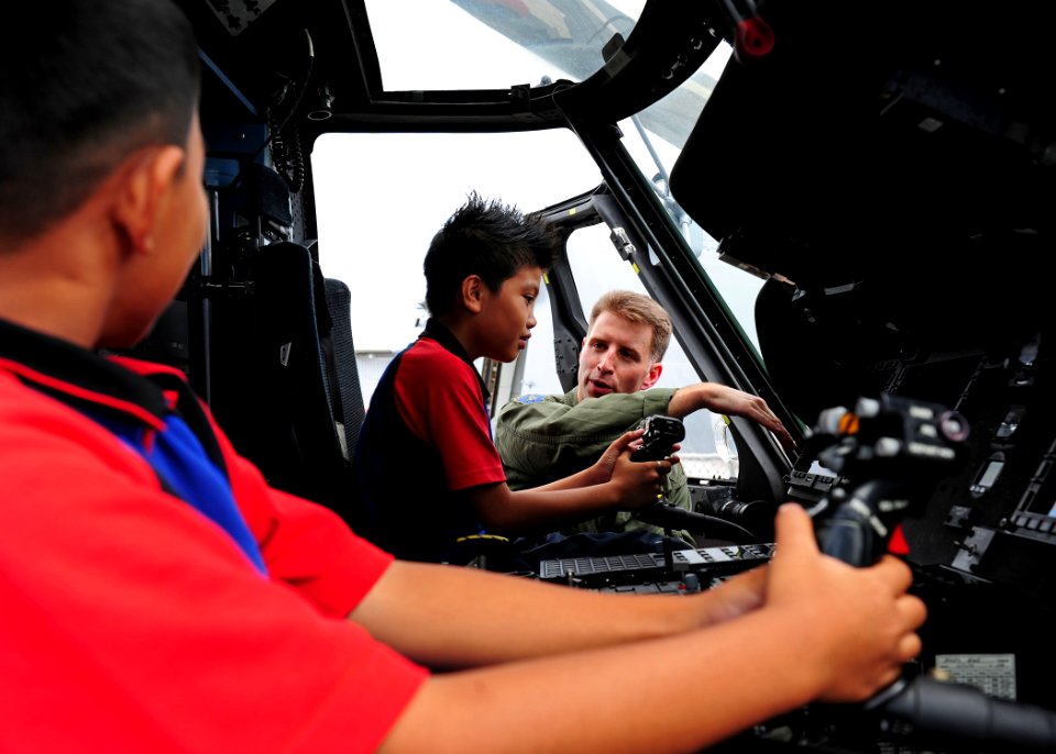US Navy 111004-N-ED900-143 Lt. Cmdr. Jon Baron, Air Boss of the Raptors of Helicopter Strike Maritime Squadron (HSM) 71, Detachment 4, talks about