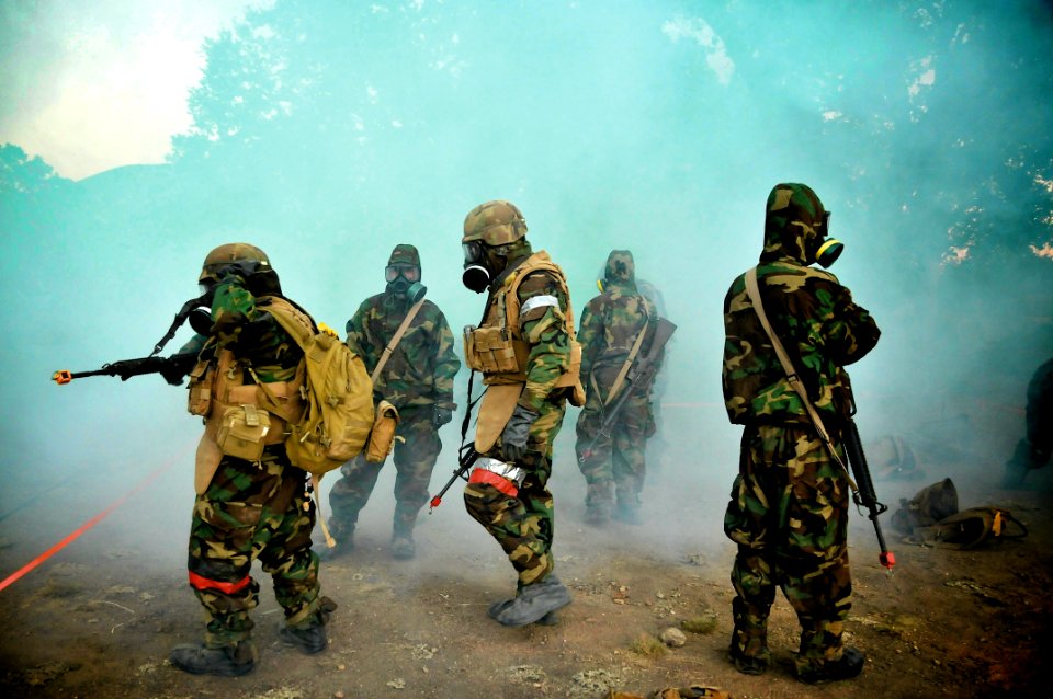 US Navy 110930-N-SM578-062 Seabees assigned to Naval Mobile Construction Battalion (NMCB) 40, conduct drills in full chemical protective gear. v