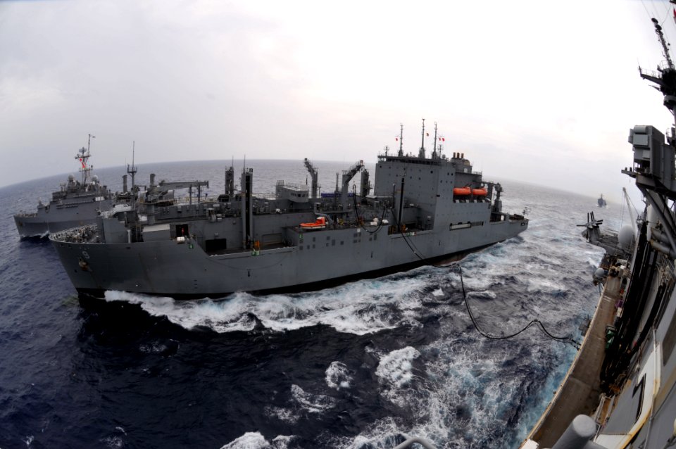 US Navy 111003-N-KM175-002 The Military Sealift Command dry cargo and ammunition ship USNS Matthew Perry (T-AKE 9) conducts a replenishment at sea