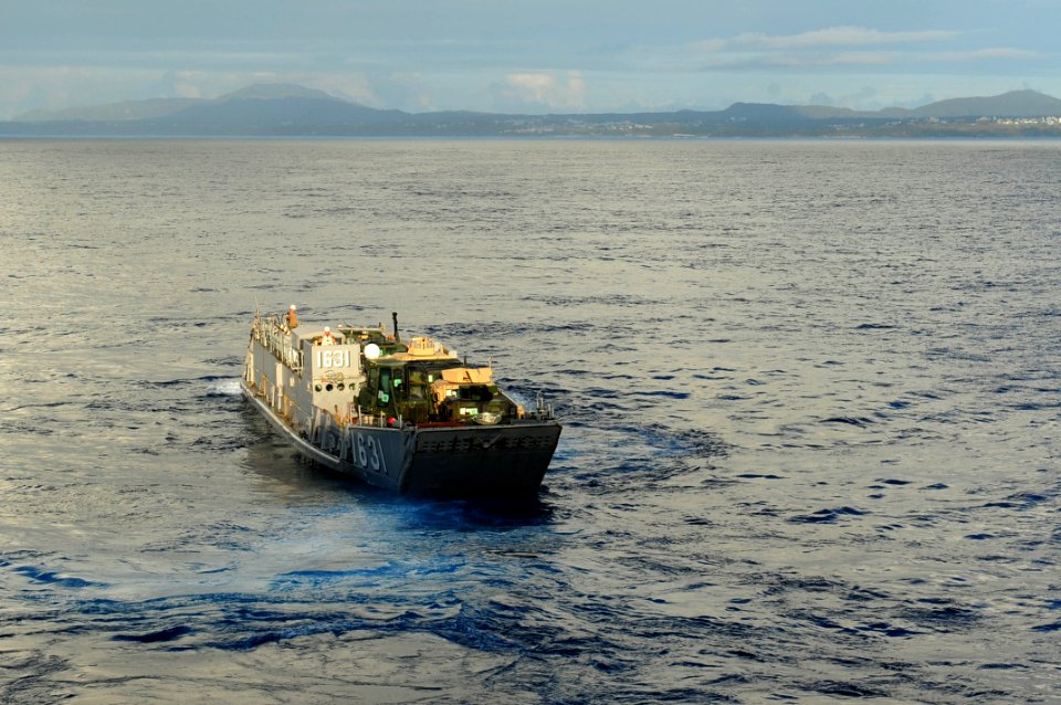 US Navy 110930-N-WA347-011 Landing Craft Utility (LCU) 1631 departs the well deck of the forward-deployed amphibious assault ship USS Essex (LHD 2)