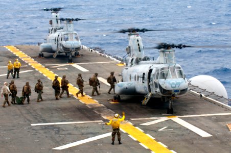 US Navy 111002-N-KM175-161 Marines assigned to the 31st Marine Expeditionary Unit (31st MEU) board CH-46E Sea Knight helicopters assigned to Marine photo