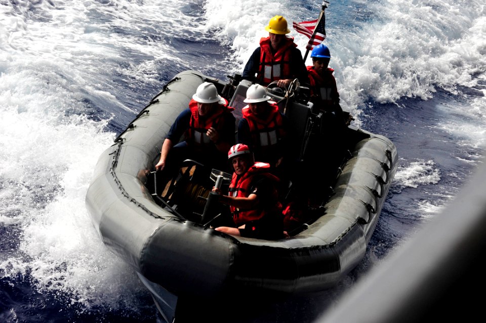 US Navy 111005-N-JO245-118 Sailors assigned to the aircraft carrier USS George Washington (CVN 73) prepare to dock a rigid-hull inflatable boat