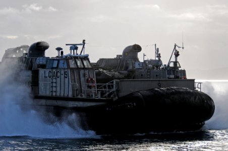 US Navy 110930-N-MW330-215 A landing craft air cushion prepares to enter the well deck photo